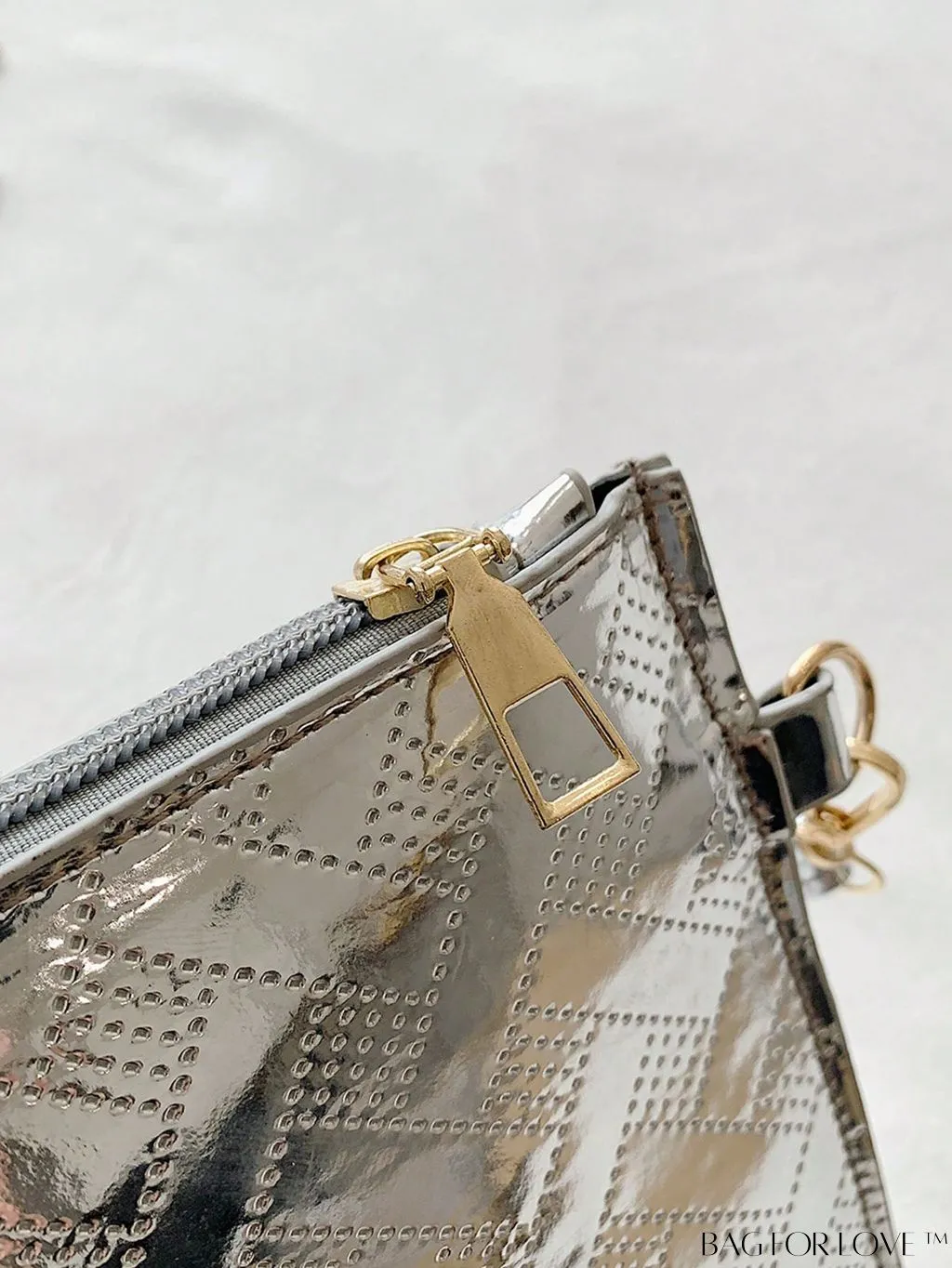 BagForLove - Geometric Embossed Metallic Clutch with Metal Decor and Zipper Closure