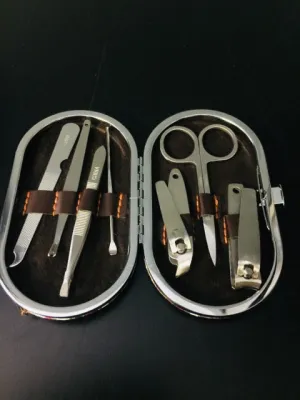 Brand new 7 piece manicure set in Paisley Pink & Brown faux leather snap closure case!!