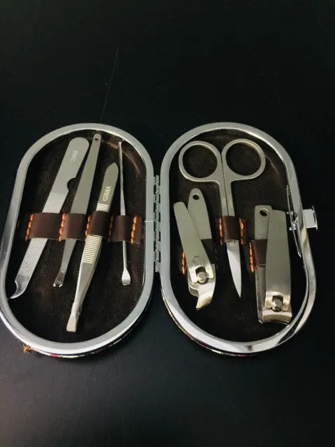 Brand new 7 piece manicure set in Paisley Pink & Brown faux leather snap closure case!!