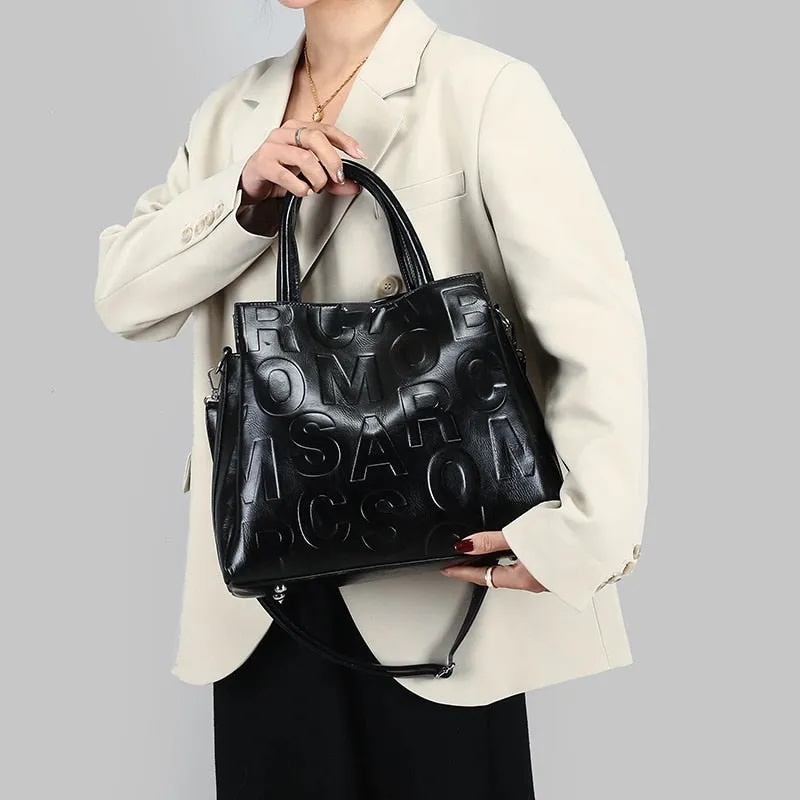 Kayla Letter Embossed Trapeze Bag - 4 Colors