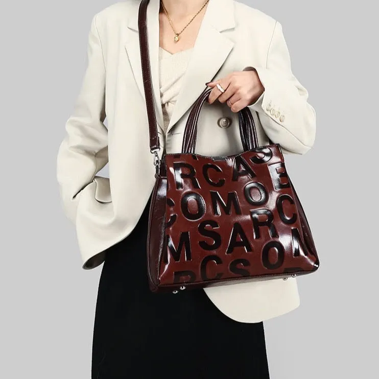 Kayla Letter Embossed Trapeze Bag - 4 Colors