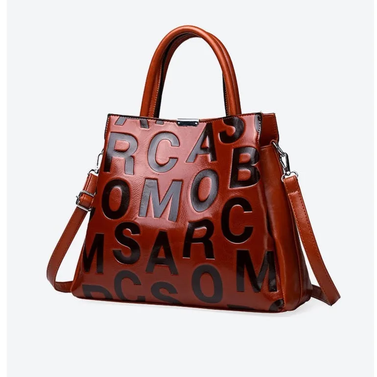 Kayla Letter Embossed Trapeze Bag - 4 Colors